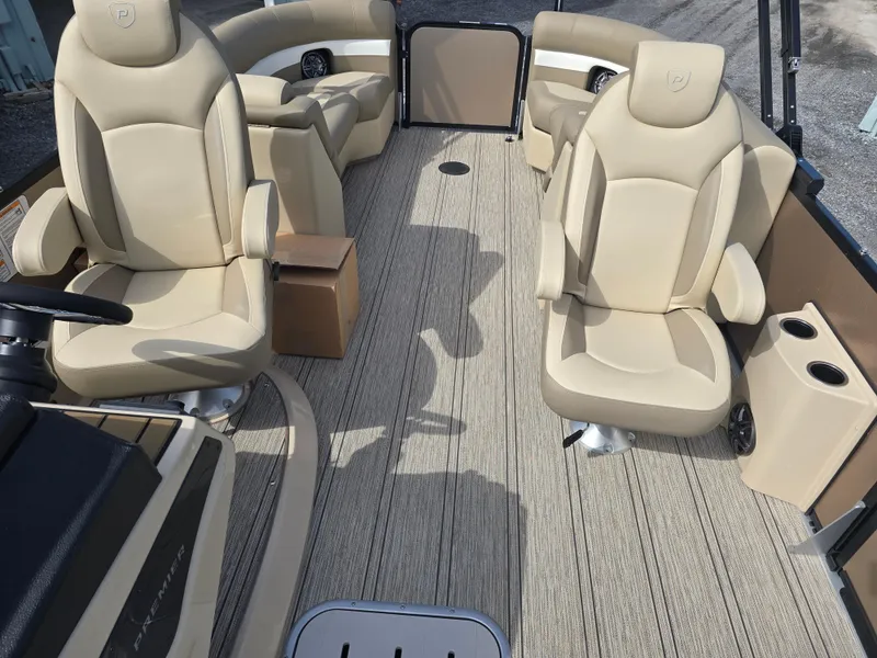 Slide: The Image of Luxurious seating on 2025 Premier 230 SunSation RF pontoon boat, featuring beige upholstery. - 25