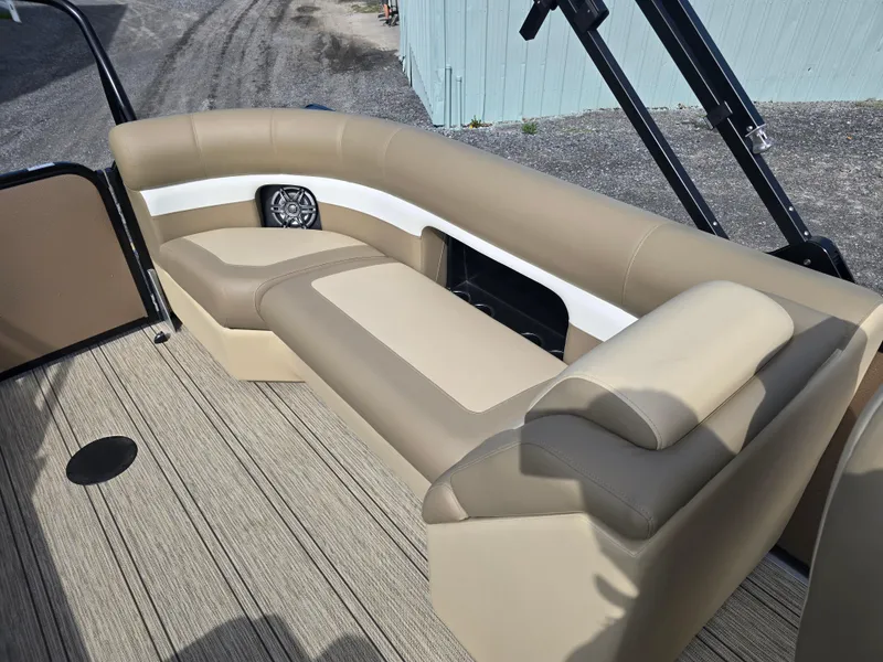 Slide: The Image of 2025 Premier 230 SunSation RF boat interior with beige seating and modern dashboard. - 26