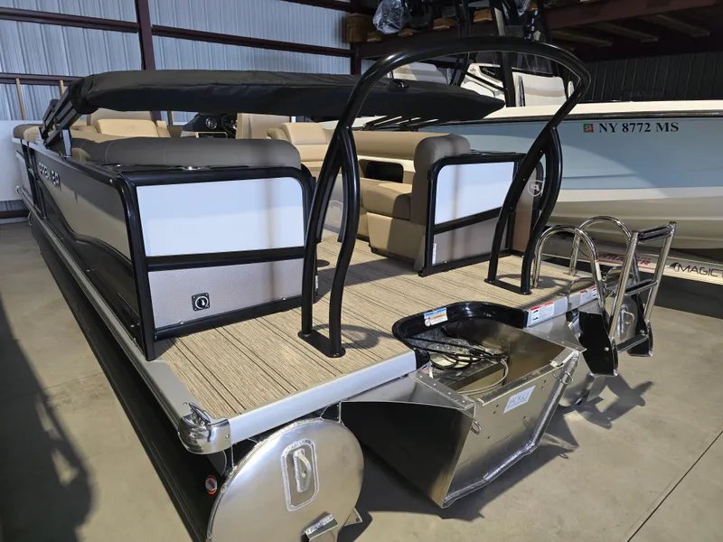 Slide: The Image of 2025 Premier 230 SunSation RF pontoon boat on trailer, parked outdoors. - 3