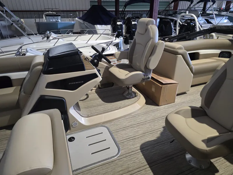 Slide: The Image of Interior of 2025 Premier 230 SunSation RF pontoon boat with beige seating. - 9