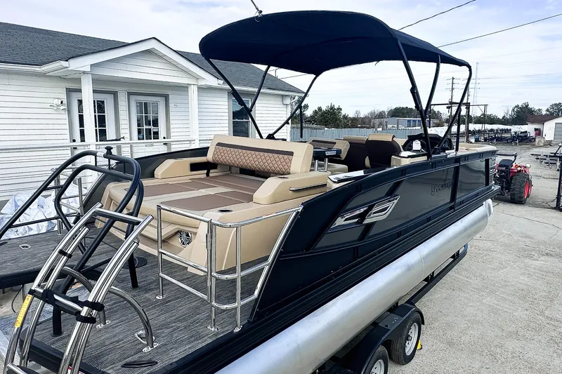 Slide: The Image of Luxurious interior of 2025 Godfrey AquaPatio 25' Flip Lounge Tritoon with plush seating and table. - 20