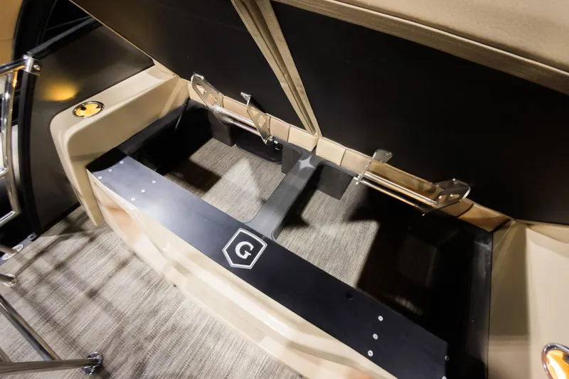 Slide: The Image of 2025 Godfrey AquaPatio 25' Flip Lounge Tritoon interior storage compartment detail. - 25