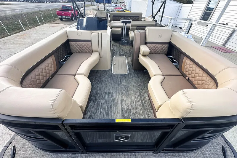 Slide: The Image of 2025 Godfrey AquaPatio 25' Flip Lounge Tritoon interior with luxurious seating and modern design. - 3