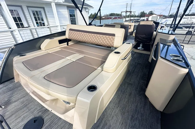 Slide: The Image of 2025 Godfrey AquaPatio 25' Tritoon with luxurious flip lounge seating and modern design. - 45