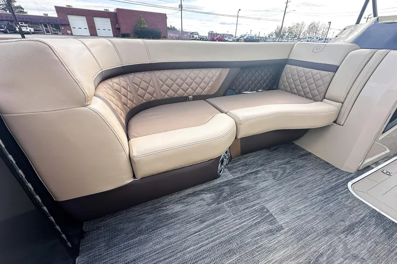 Slide: The Image of Luxurious interior of 2025 Godfrey AquaPatio 25' Flip Lounge Tritoon boat, featuring elegant seating. - 6