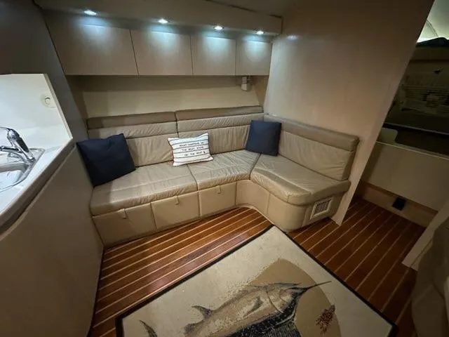 Slide: The Image of Luxurious interior of 1996 Tiara Yachts 43 Open with leather seating and nautical decor. - 17