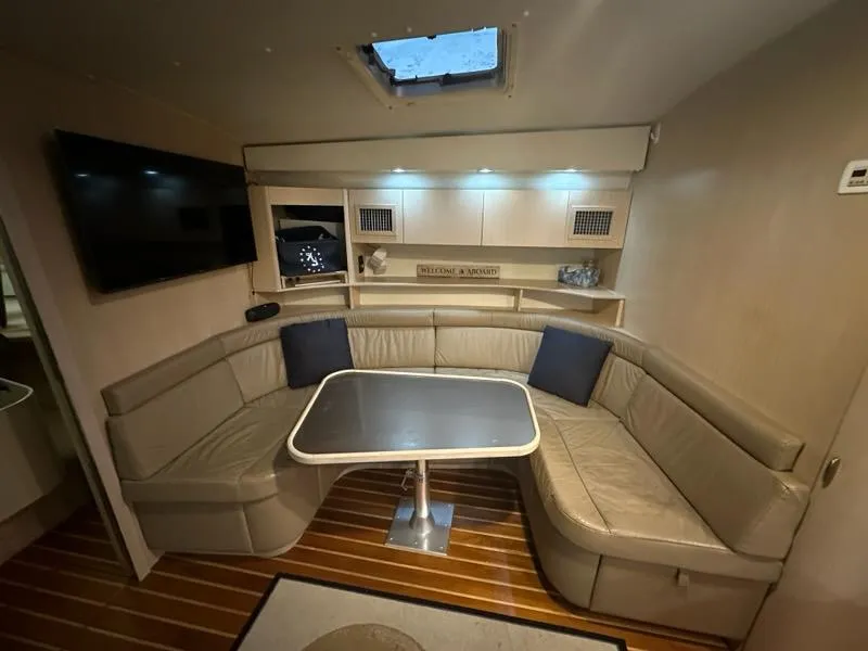 Slide: The Image of Luxurious interior of 1996 Tiara Yachts 43 Open with cozy seating and modern amenities. - 18