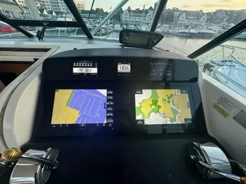 Slide: The Image of Tiara Yachts 1996 43 Open dashboard with navigation screens in marina setting. - 3