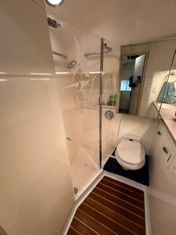 Slide: The Image of Bathroom interior of 1996 Tiara Yachts 43 Open with shower and toilet. - 30