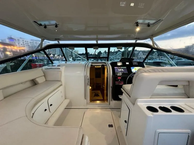 Slide: The Image of 1996 Tiara Yachts 43 Open cockpit with modern helm and seating. - 31