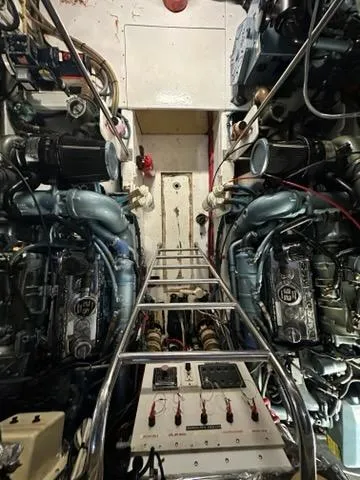 Slide: The Image of Engine room of 1996 Tiara Yachts 43 Open, showcasing dual engines and control systems. - 35