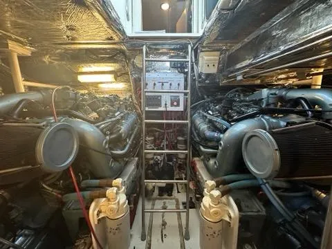 Slide: The Image of Engine room of 1996 Tiara Yachts 43 Open, featuring dual engines and control panel. - 36