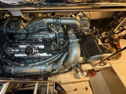 Slide: The Image of Engine compartment of 1996 Tiara Yachts 43 Open, showcasing detailed mechanical components. - 44