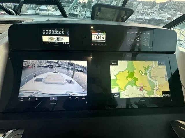 Slide: The Image of Tiara Yachts 1996 43 Open dashboard with navigation screens and controls. - 5