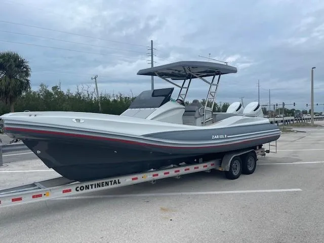 Slide: The Image of 2023 Zar Formenti 85 SL boat on trailer in parking lot. - 2