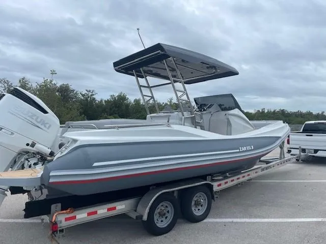 Slide: The Image of 2023 Zar Formenti 85 SL boat on trailer, parked outdoors under cloudy sky. - 6