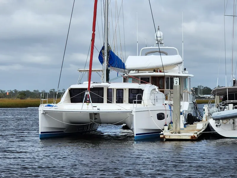 Slide: The Image of 2015 Leopard 44 catamaran docked on a cloudy day. - 1