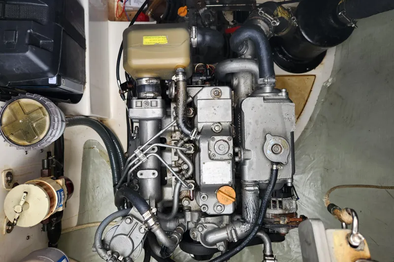 Slide: The Image of Engine compartment of a 2015 Leopard 44 yacht, showcasing detailed mechanical components. - 100