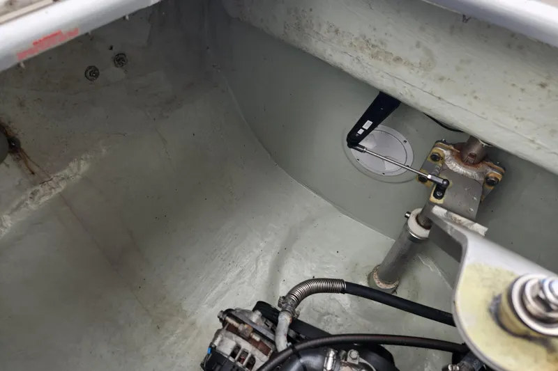 Slide: The Image of Engine compartment of a 2015 Leopard 44 boat, showing mechanical components and wiring. - 105