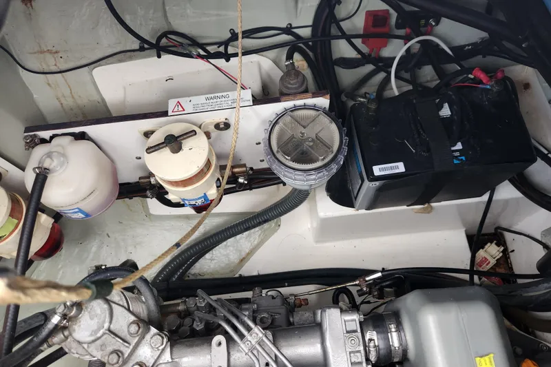 Slide: The Image of Engine compartment of a 2015 Leopard 44 yacht, featuring filters and battery components. - 108