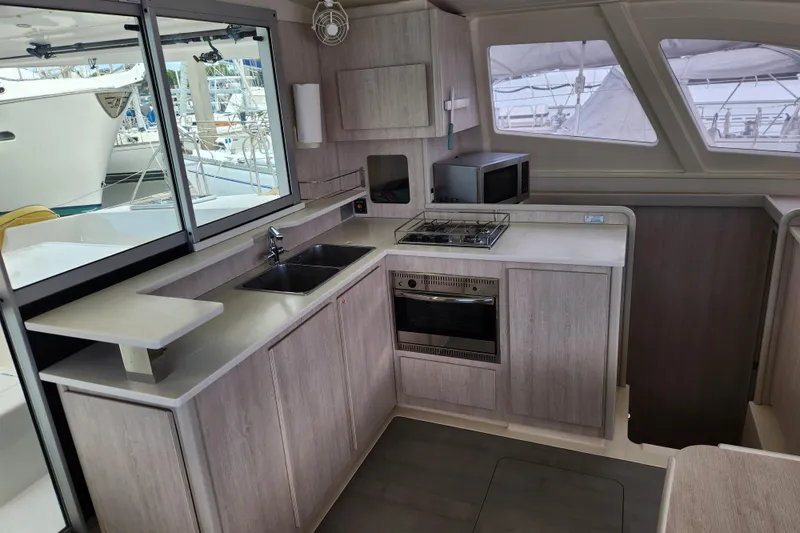 Slide: The Image of Modern kitchen interior of 2015 Leopard 44 yacht with stove, sink, and microwave. - 114