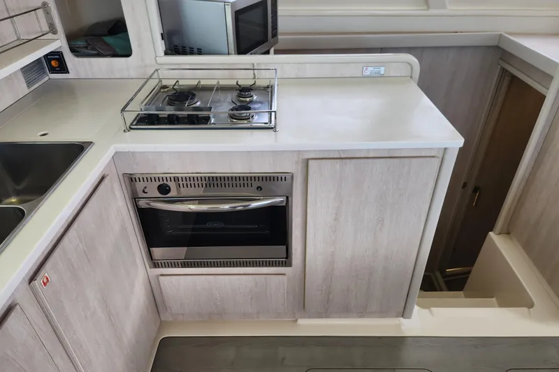 Slide: The Image of Modern kitchen in a 2015 Leopard 44 yacht with stove and oven. - 115