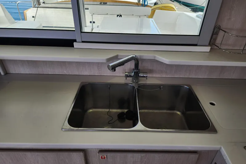 Slide: The Image of 2015 Leopard 44 yacht kitchen sink with dual basins and modern faucet. - 116