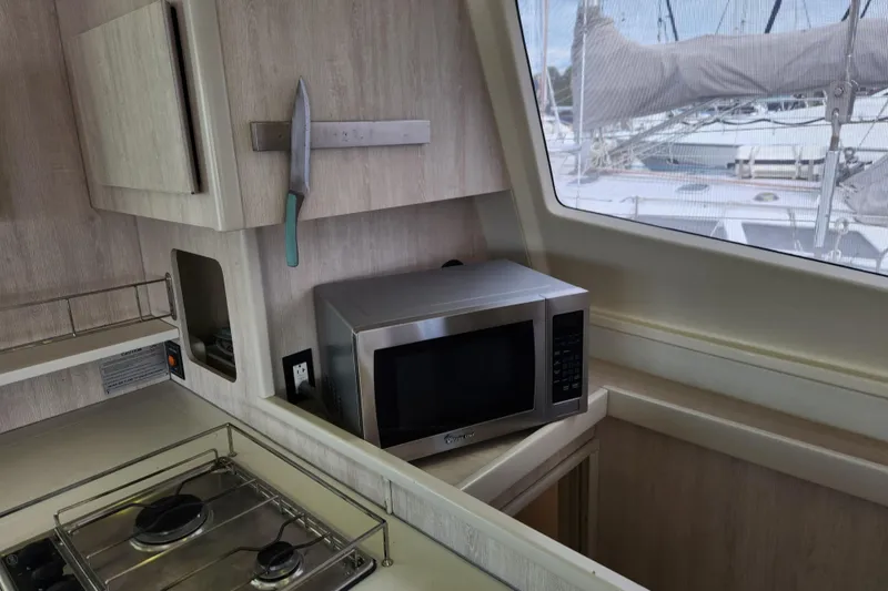 Slide: The Image of Galley kitchen in 2015 Leopard 44 yacht with microwave and stove. - 118