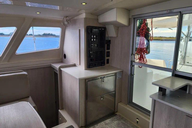 Slide: The Image of Interior of 2015 Leopard 44 catamaran with control panel and ocean view. - 119