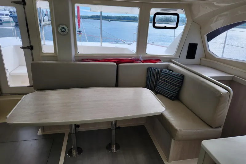 Slide: The Image of Interior of 2015 Leopard 44 catamaran with dining area and scenic window view. - 125