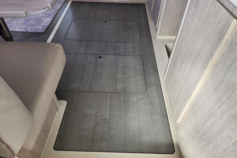 Slide: The Image of Interior of 2015 Leopard 44 yacht with sleek wooden flooring and seating area. - 126