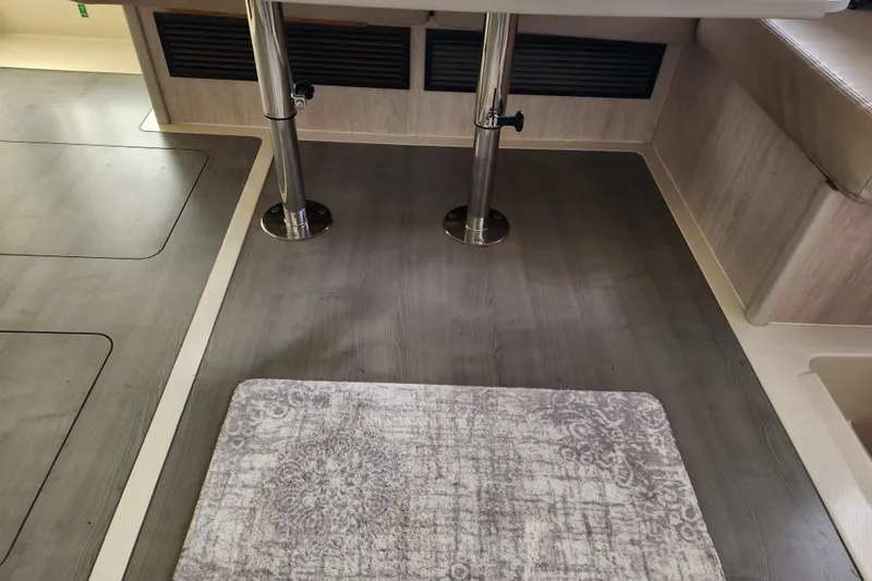 Slide: The Image of Interior of a 2015 Leopard 44 yacht with wooden flooring and a patterned rug. - 127