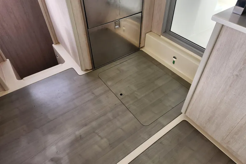 Slide: The Image of Interior of 2015 Leopard 44 yacht with sleek wooden flooring and modern design. - 128