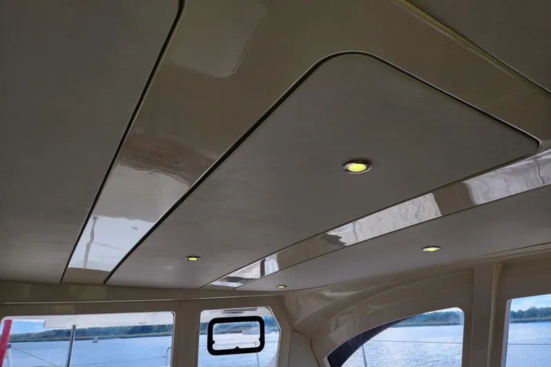 Slide: The Image of Interior ceiling of a 2015 Leopard 44 catamaran with recessed lighting. - 129