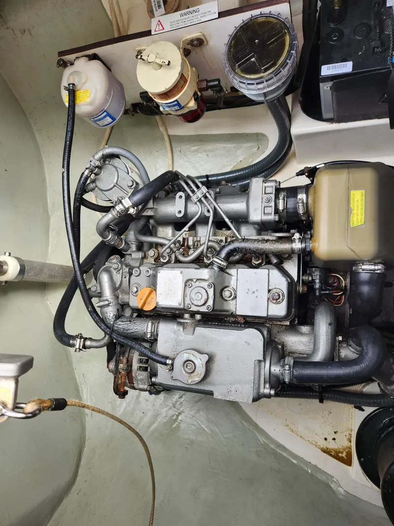 Slide: The Image of 2015 Leopard 44 catamaran cockpit with seating and table, docked at marina. - 13