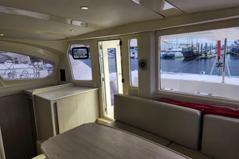 Slide: The Image of Interior of 2015 Leopard 44 catamaran with marina view through large windows. - 132