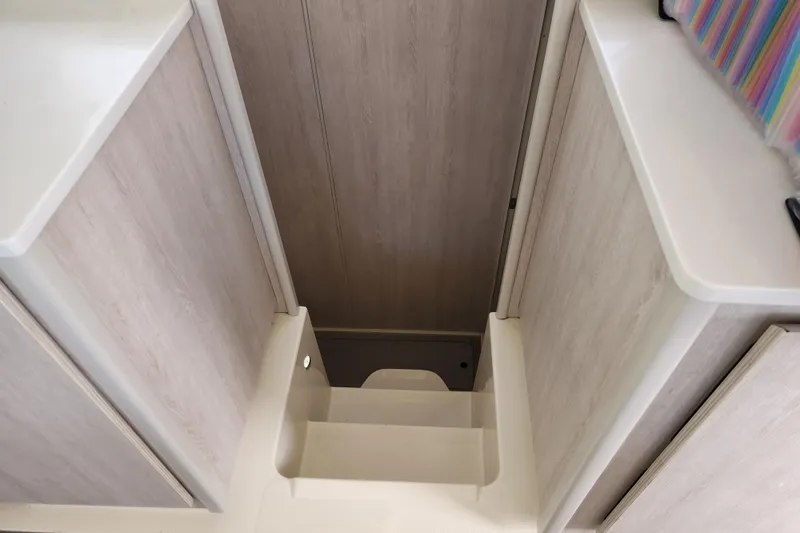 Slide: The Image of Staircase inside 2015 Leopard 44 catamaran with light wood finish. - 135