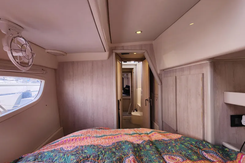 Slide: The Image of Interior of 2015 Leopard 44 yacht cabin with colorful bedding and modern design. - 138