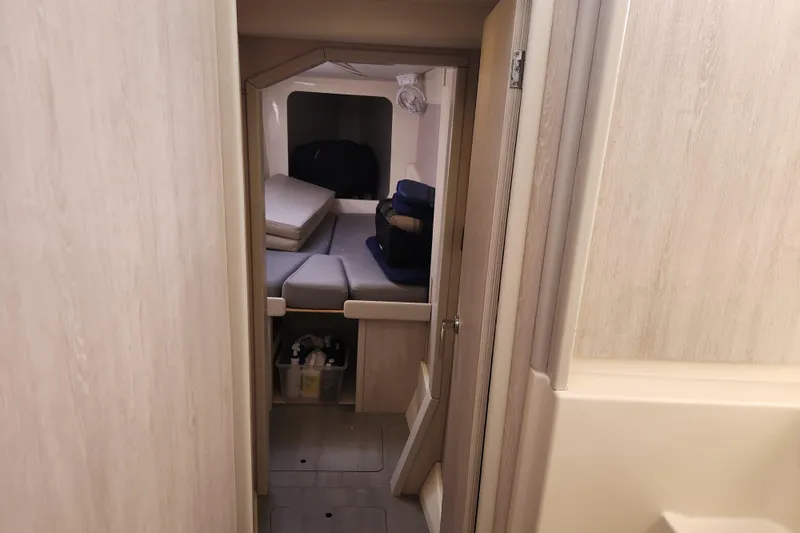 Slide: The Image of Interior cabin view of a 2015 Leopard 44 catamaran, featuring a cozy sleeping area. - 149