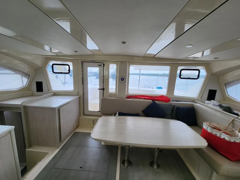 Slide: The Image of Spacious deck area of a 2015 Leopard 44 catamaran with seating and table. - 15
