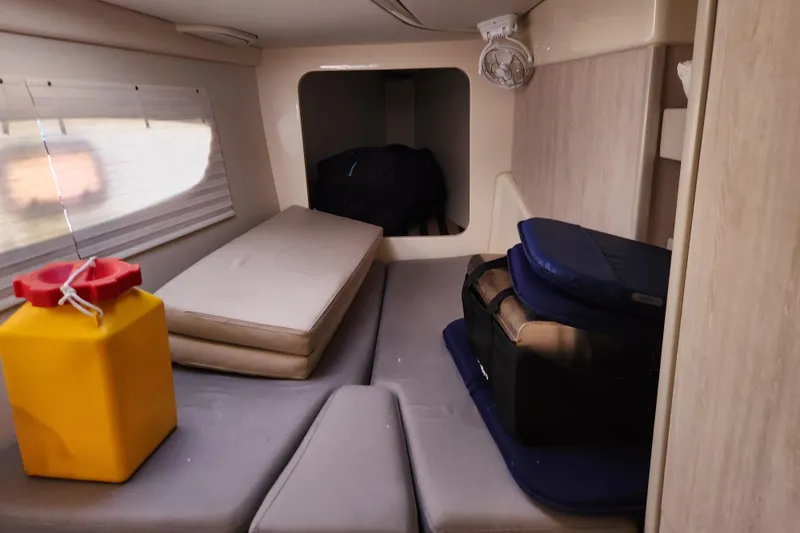 Slide: The Image of Interior cabin of a 2015 Leopard 44 catamaran with cushions and storage. - 150