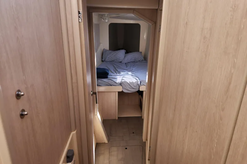 Slide: The Image of Cozy cabin interior of 2015 Leopard 44 yacht with neatly made bed. - 162