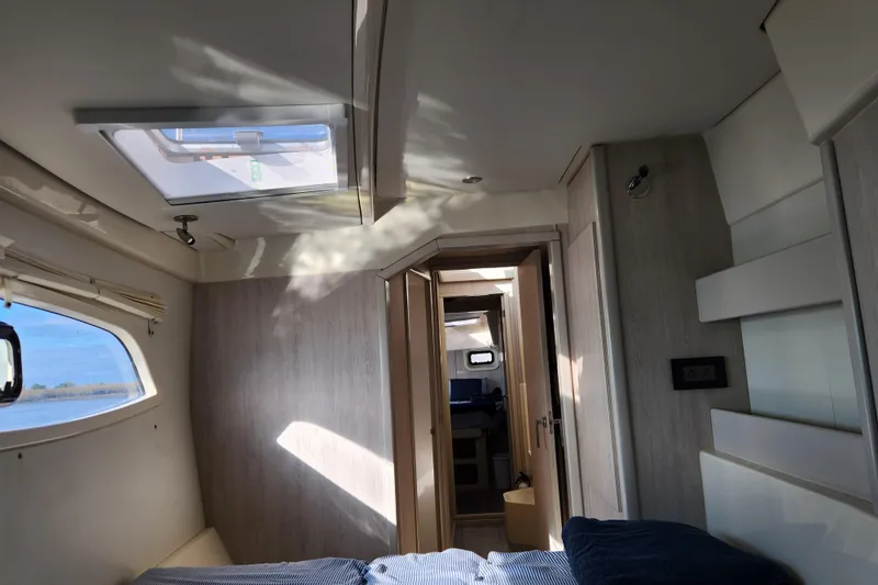 Slide: The Image of Interior of a 2015 Leopard 44 catamaran, featuring modern design and natural light. - 166