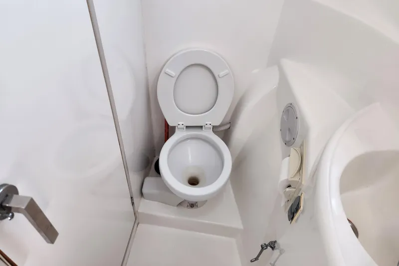 Slide: The Image of Compact bathroom on a 2015 Leopard 44 yacht with toilet and sink. - 173
