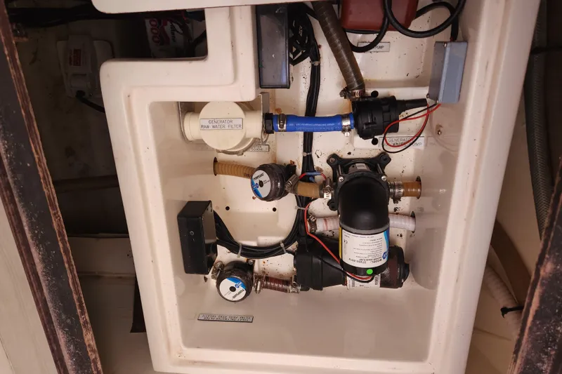 Slide: The Image of Engine compartment of a 2015 Leopard 44, showcasing water filtration and pump system. - 176