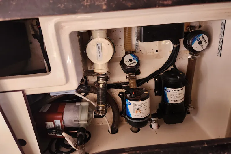 Slide: The Image of Engine compartment of a 2015 Leopard 44 yacht with various mechanical components. - 177