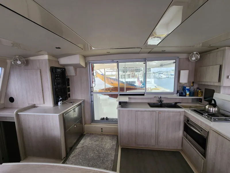 Slide: The Image of 2015 Leopard 44 yacht cockpit with seating, table, and storage compartments. - 18