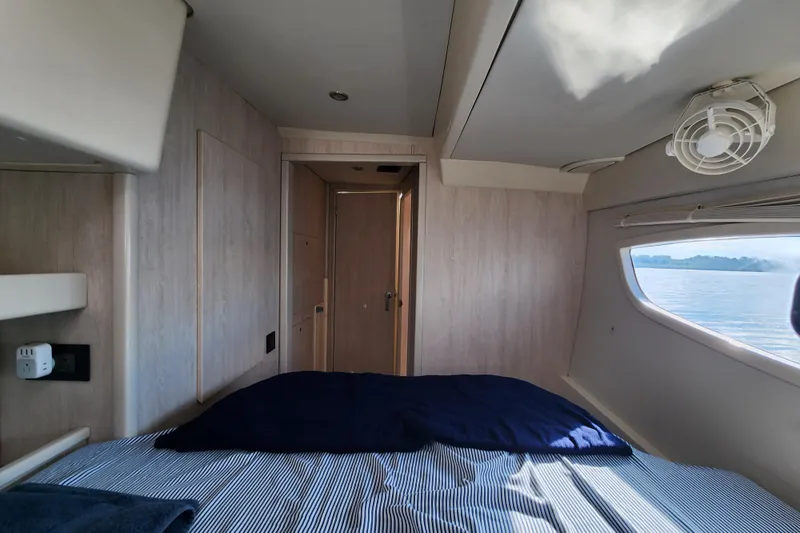 Slide: The Image of Cozy cabin interior of 2015 Leopard 44 yacht with ocean view through window. - 181