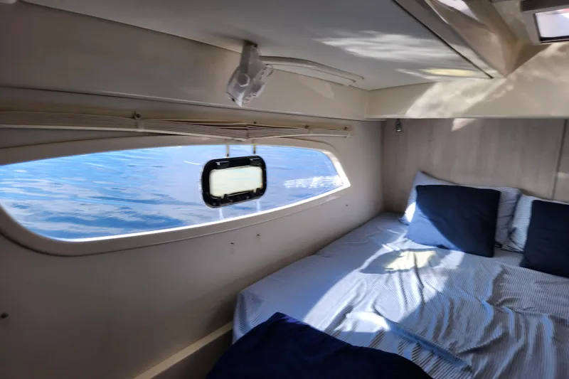 Slide: The Image of Cozy cabin interior of 2015 Leopard 44 yacht with ocean view through window. - 183