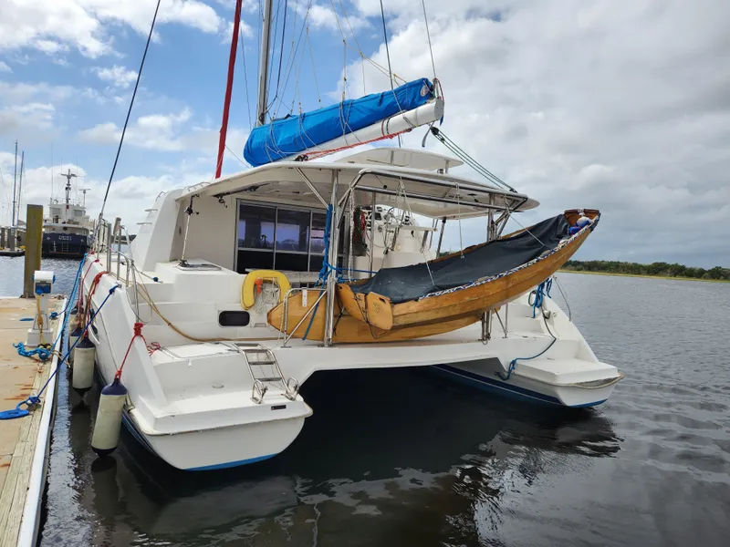 Slide: The Image of 2015 Leopard 44 yacht docked with fenders and ropes, marina setting. - 4